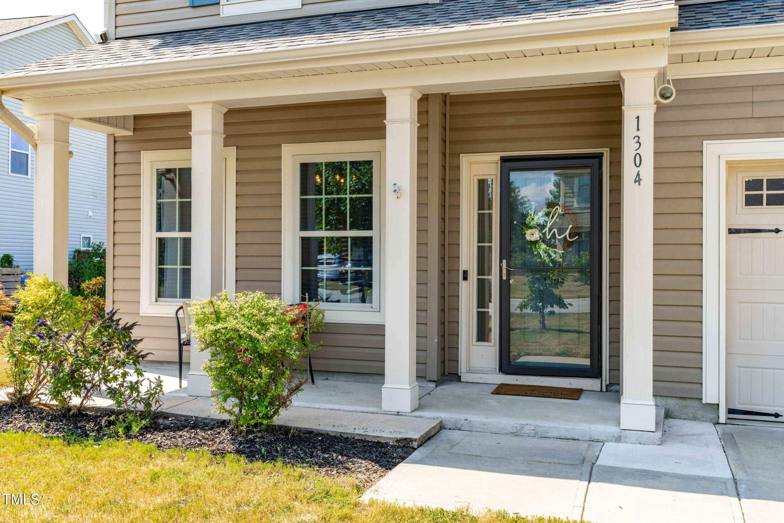 1304 Ivey Grove Court Fuquay-Varina, NC 27526 - Photo 3 of 44 a view of a entryway door front of house