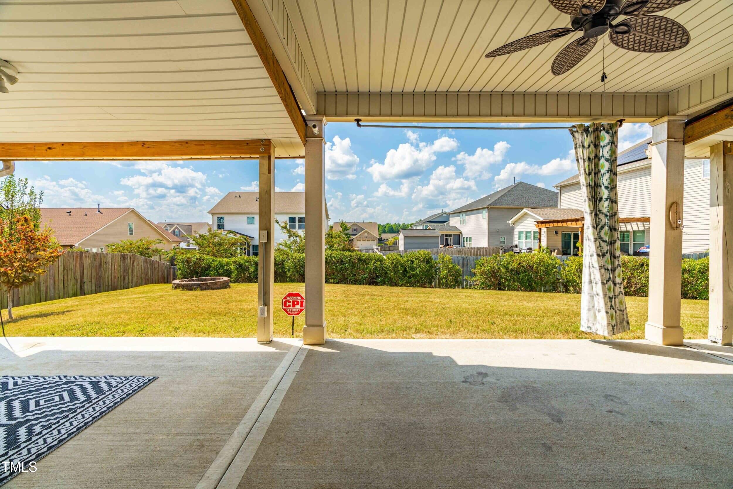 1304 Ivey Grove Court Fuquay-Varina, NC 27526 - Photo 34 of 44 a view of swimming pool with lawn chairs under an umbrella