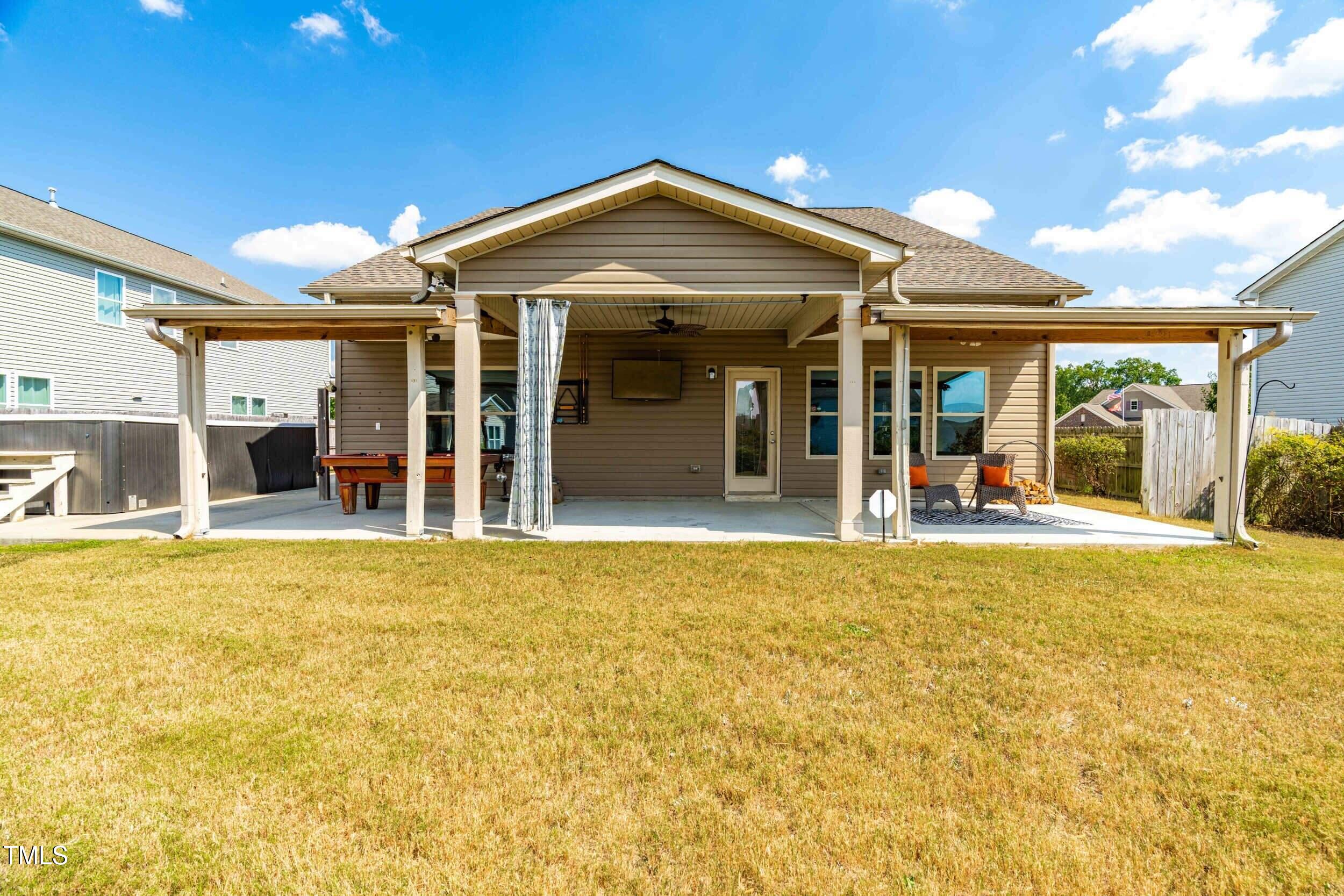 1304 Ivey Grove Court Fuquay-Varina, NC 27526 - Photo 38 of 44 a view of a house with a swimming pool