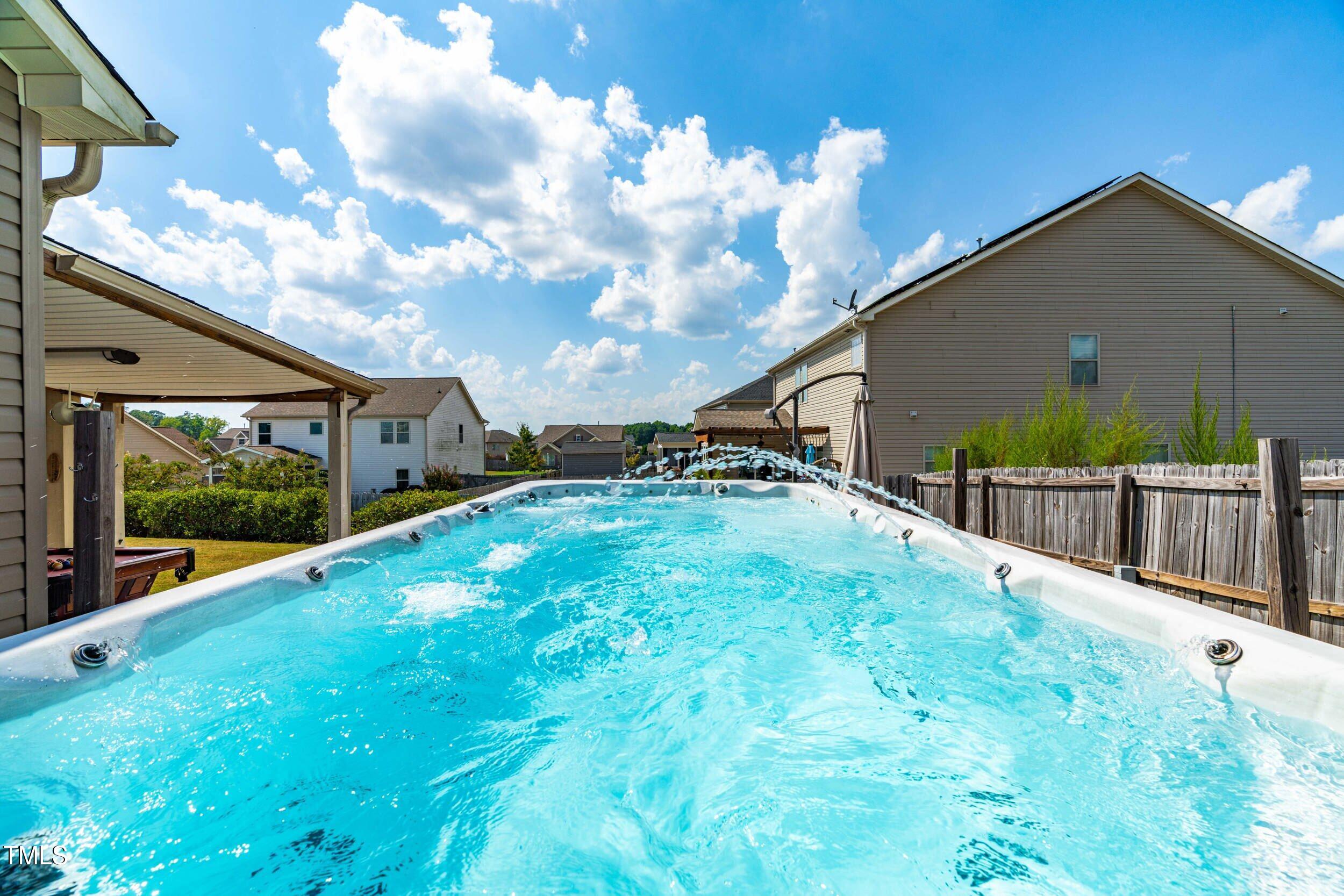 1304 Ivey Grove Court Fuquay-Varina, NC 27526 - Photo 40 of 44 a view of backyard with garden and deck
