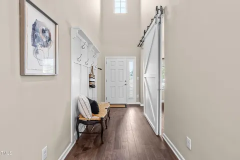a view of a hallway with seating area