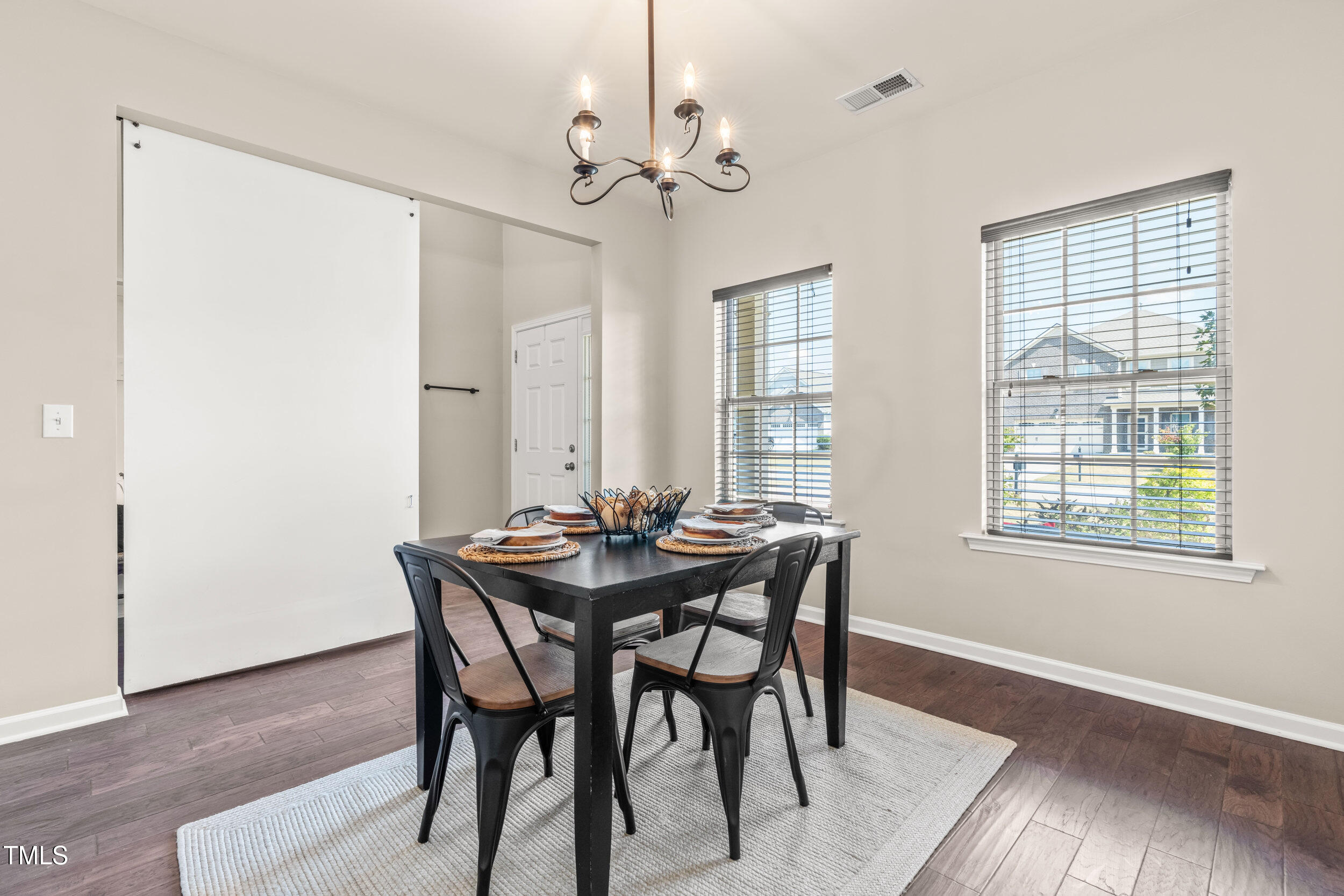 1304 Ivey Grove Court Fuquay-Varina, NC 27526 - Photo 6 of 44 a view of a dining room with furniture and window