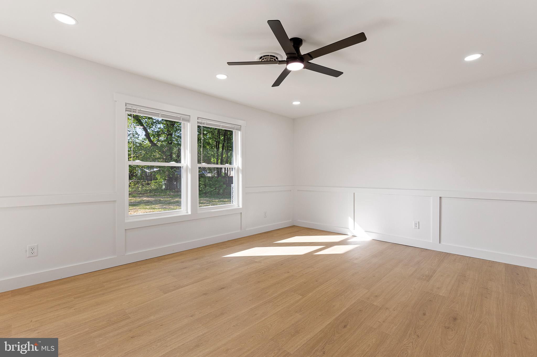 3 Queens Way Newark, DE 19713 - Photo 10 of 20 an empty room with a window and a ceiling fan