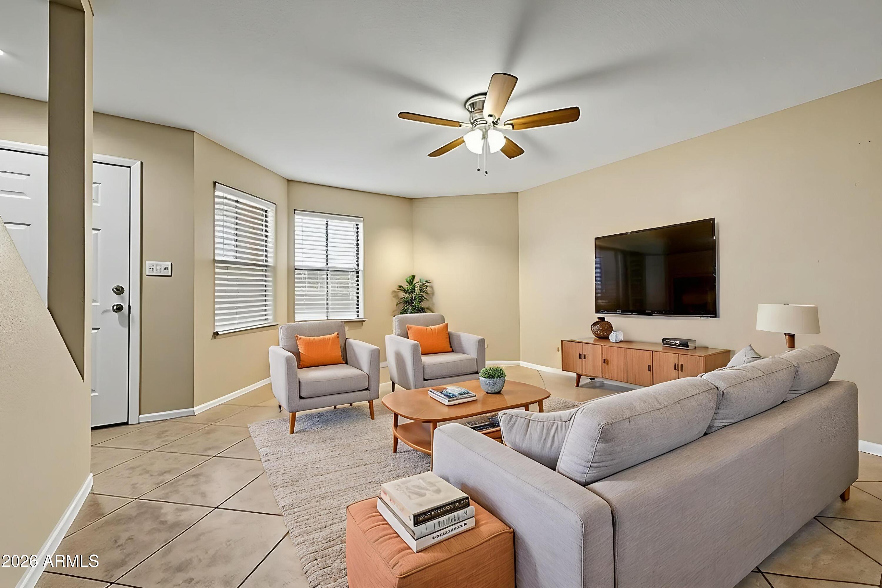 6262 East Brown Road, Unit 29 Mesa, AZ 85205 - Photo 13 of 59 a living room with furniture and a flat screen tv