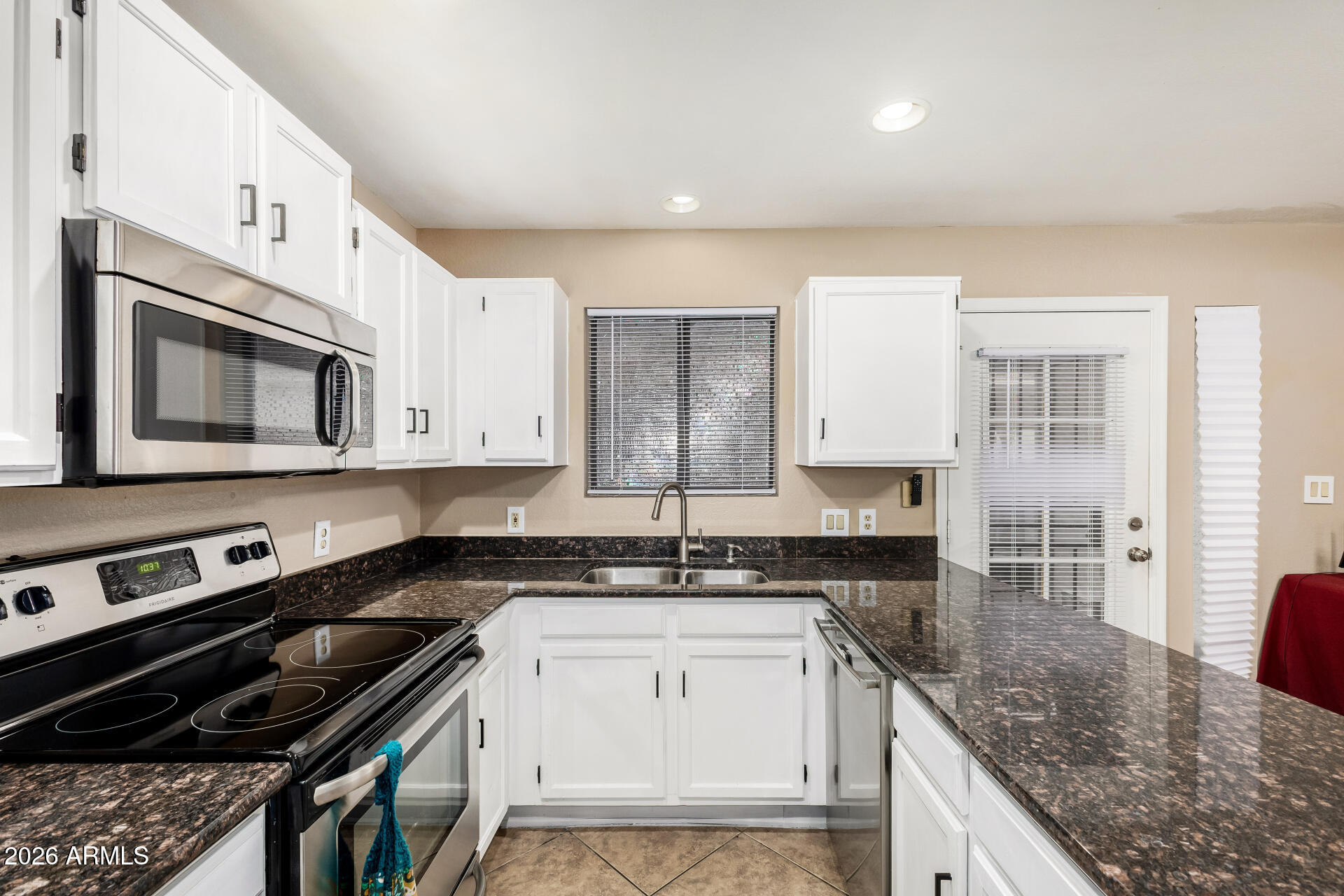 6262 East Brown Road, Unit 29 Mesa, AZ 85205 - Photo 2 of 59 a kitchen with a sink stove and microwave