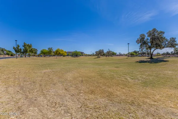a view of a park with swings and slides