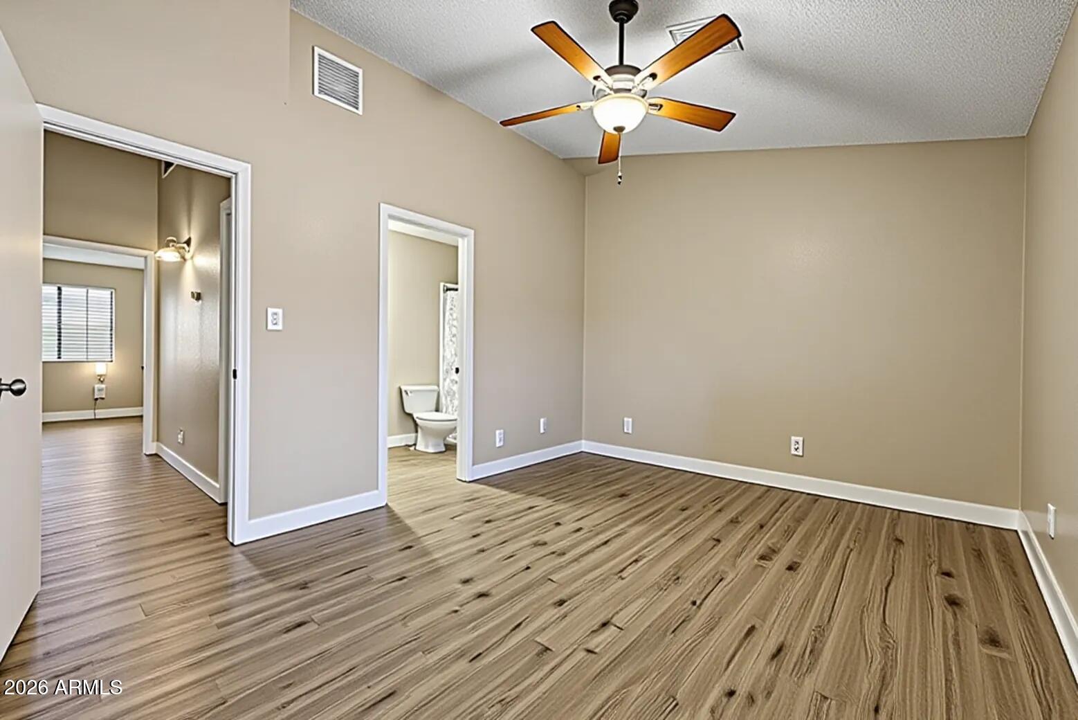 6262 East Brown Road, Unit 29 Mesa, AZ 85205 - Photo 40 of 59 wooden floor in an empty room with a window