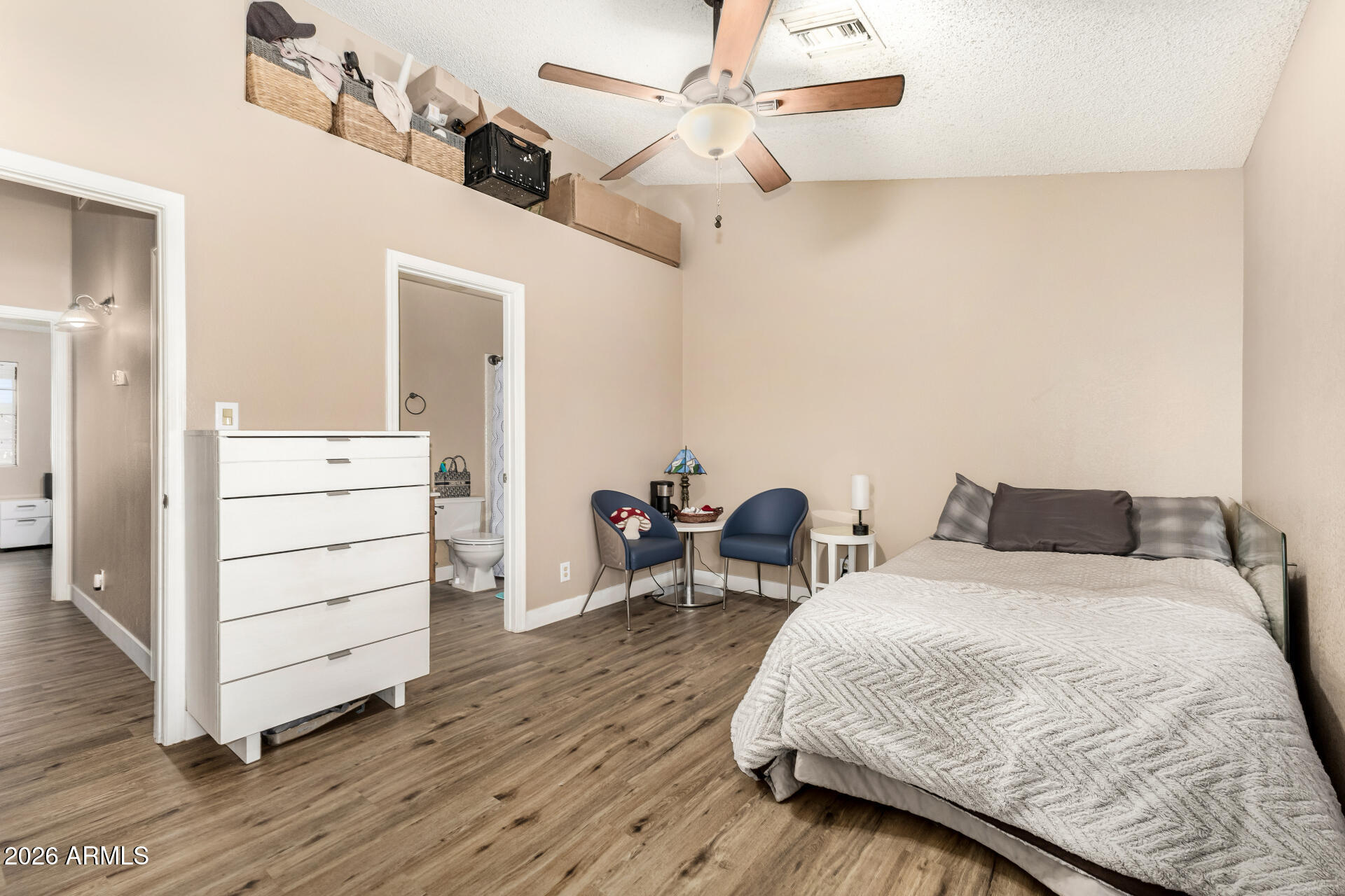 6262 East Brown Road, Unit 29 Mesa, AZ 85205 - Photo 43 of 59 a bedroom with a bed and wooden floor
