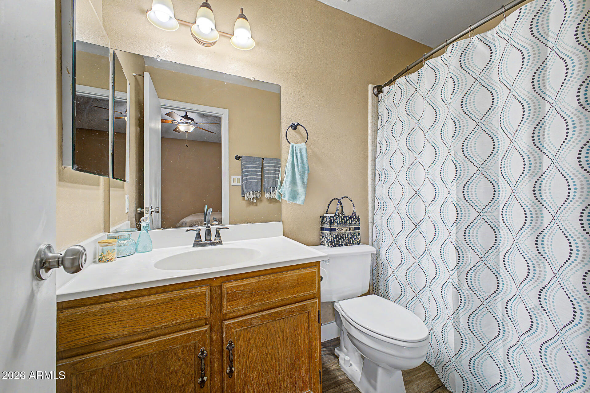 6262 East Brown Road, Unit 29 Mesa, AZ 85205 - Photo 44 of 59 a bathroom with a granite countertop sink mirror vanity and toilet