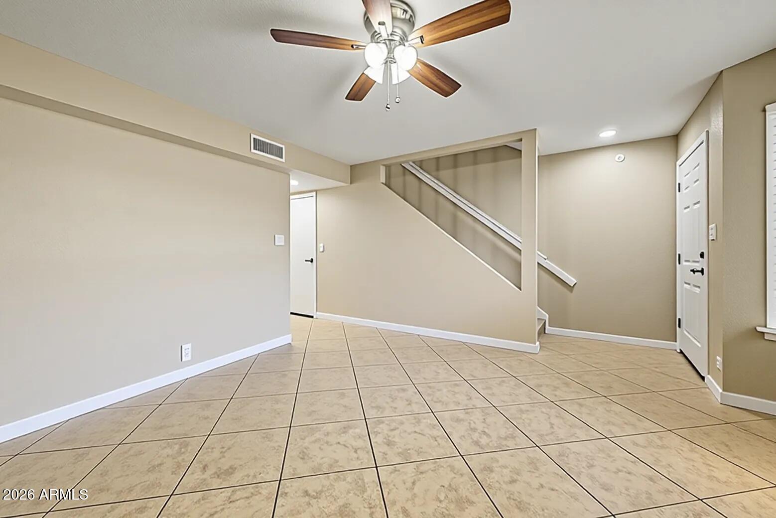 6262 East Brown Road, Unit 29 Mesa, AZ 85205 - Photo 5 of 59 a view of an empty room with a window