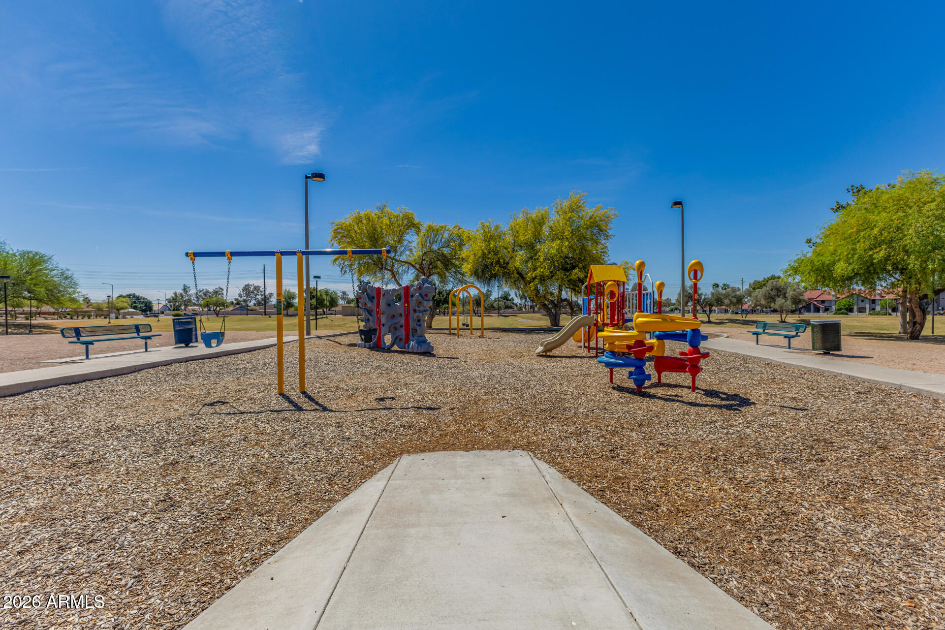 6262 East Brown Road, Unit 29 Mesa, AZ 85205 - Photo 56 of 59 a view of a park with swings and slides