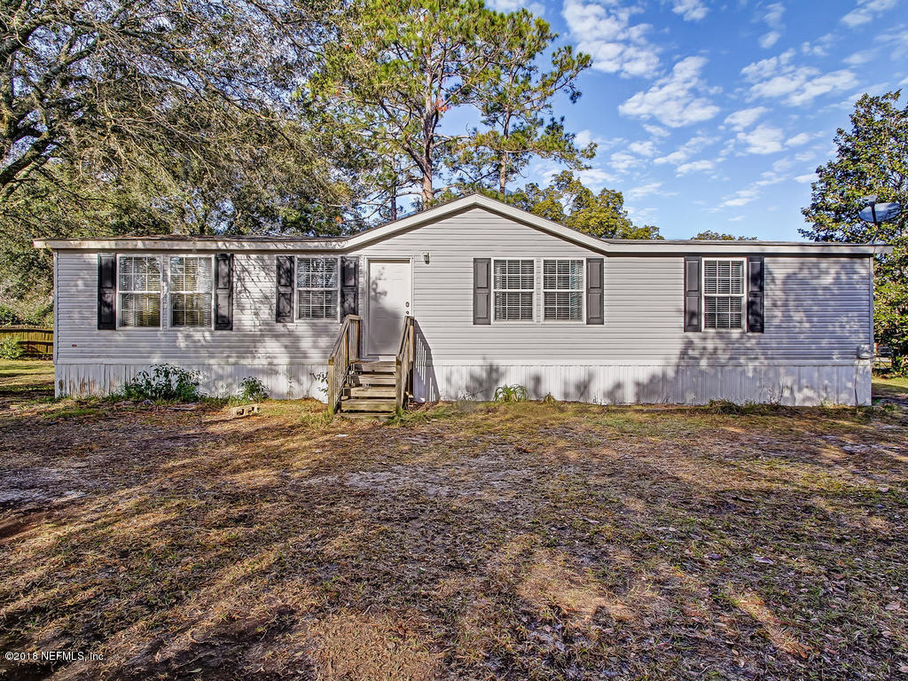 2244 Marlee Road South St. Johns, FL 32259 - Photo 1 of 38 a house with trees in the background
