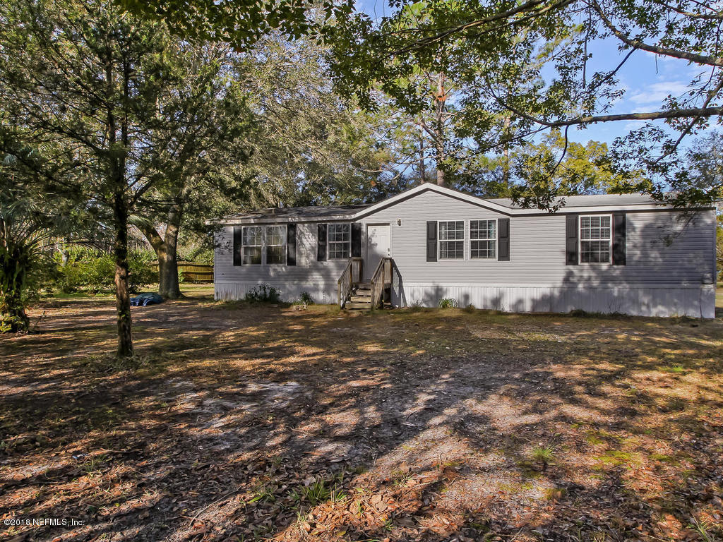 2244 Marlee Road South St. Johns, FL 32259 - Photo 2 of 38 a view of a house with a yard