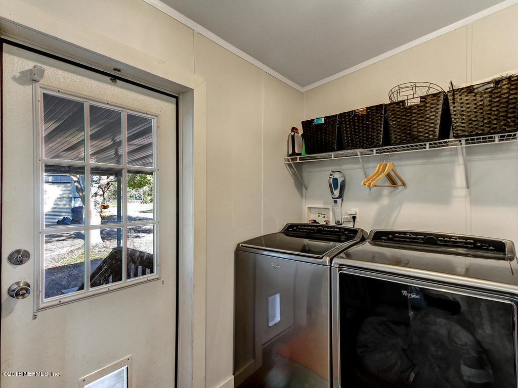 2244 Marlee Road South St. Johns, FL 32259 - Photo 25 of 38 a kitchen with a stove and a microwave