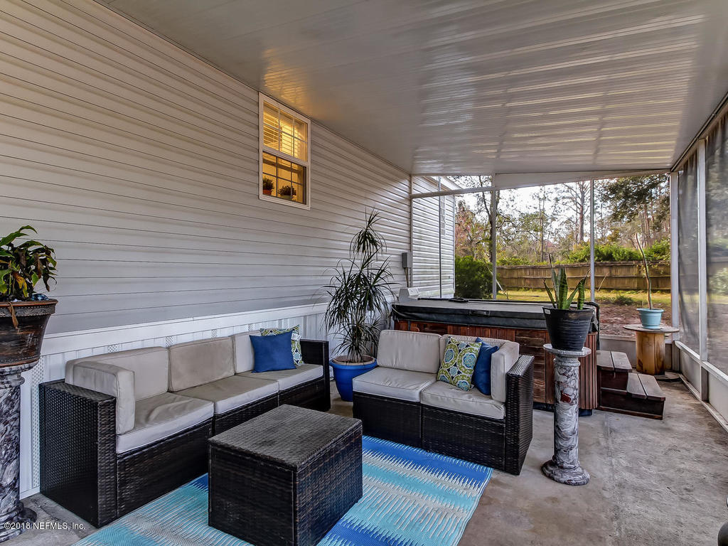 2244 Marlee Road South St. Johns, FL 32259 - Photo 26 of 38 a living room with furniture and a large window