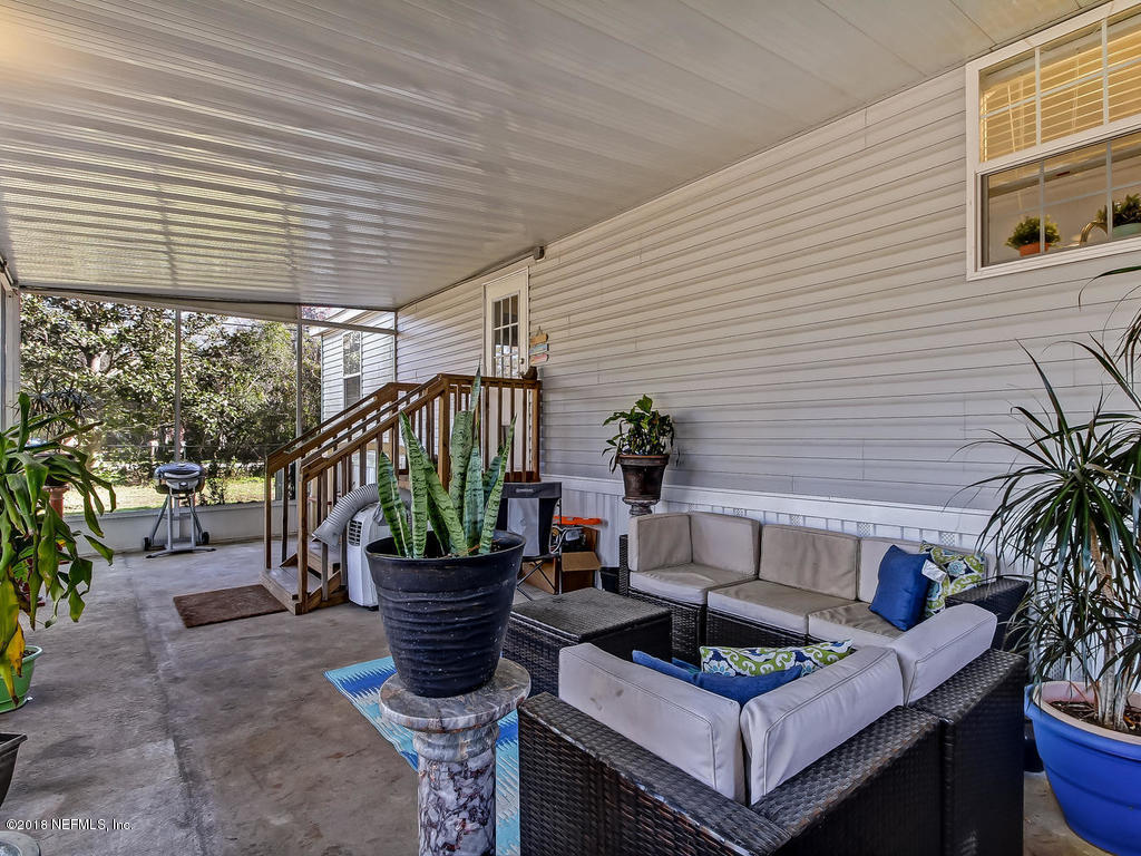 2244 Marlee Road South St. Johns, FL 32259 - Photo 28 of 38 a table and chairs in the patio