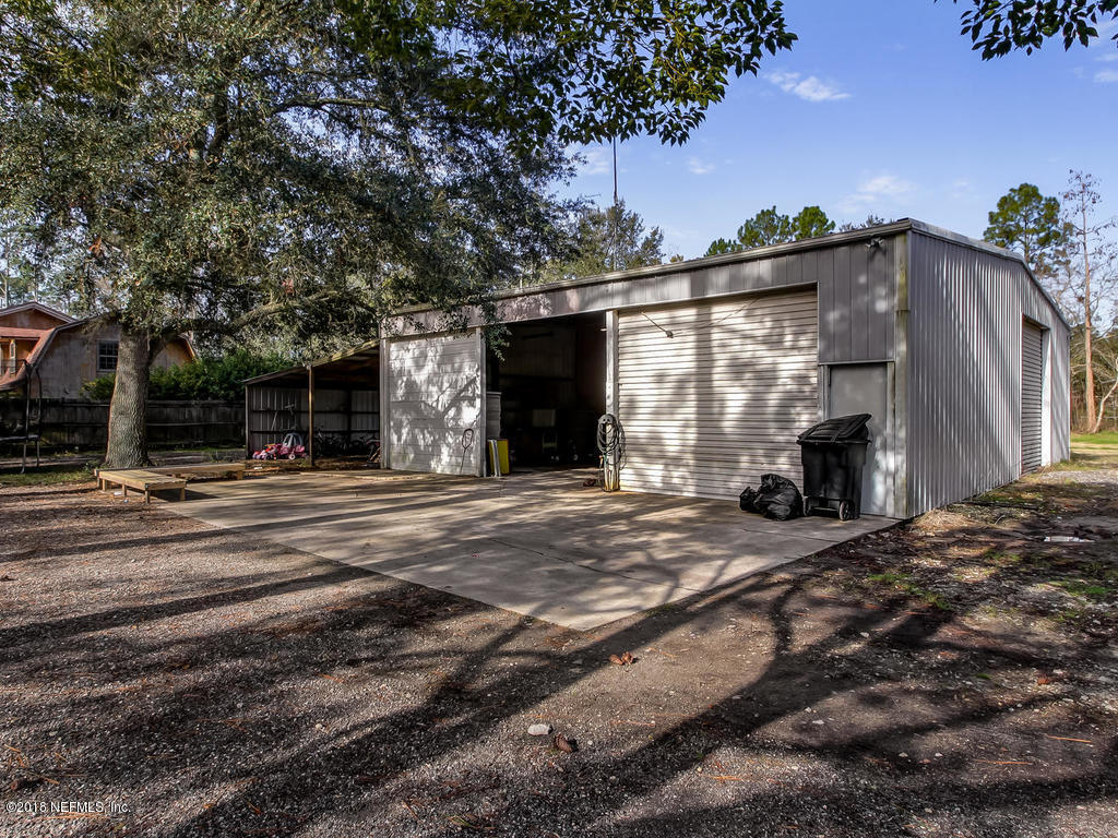 2244 Marlee Road South St. Johns, FL 32259 - Photo 33 of 38 a view of a house with a tree