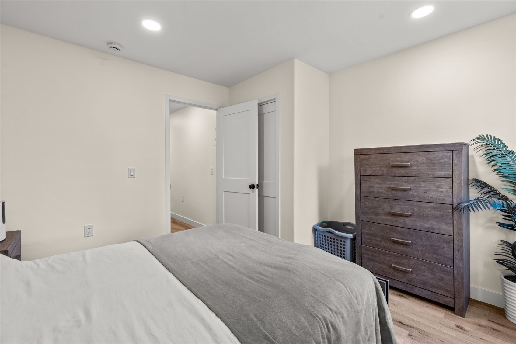 1127 Ski Hill Road, Unit 104 Breckenridge, CO 80424 - Photo 22 of 32 a bedroom with a bed and a dresser