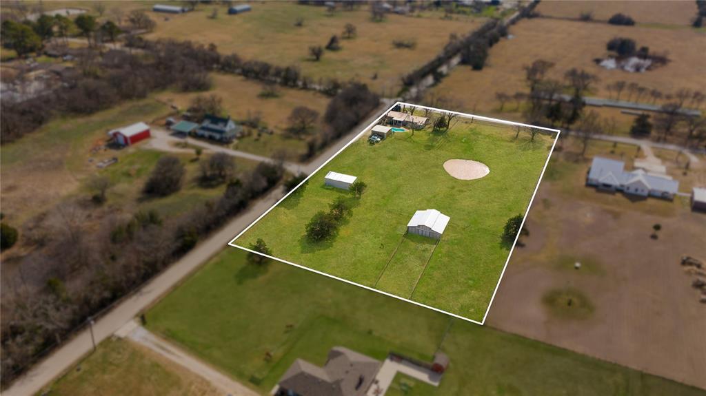 9213 Wilson Road Pilot Point, TX 76258 - Photo 3 of 38 9213 Wilson Road, Pilot Point, TX 76258 - aerial - Aerial view of property's location featuring property boundaries highlighted