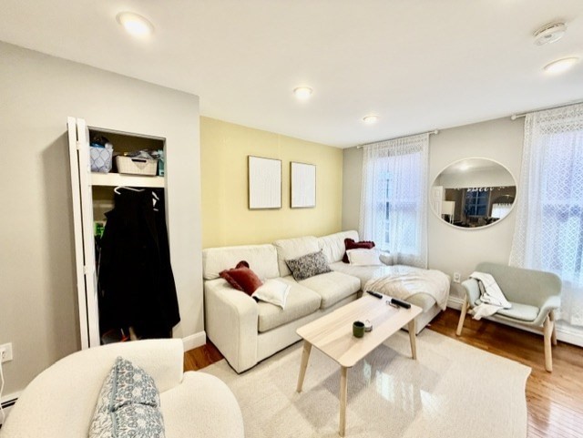 14 Cleveland Place, Unit 3 Boston, MA 02113 - Photo 17 of 22 a living room with furniture and a flat screen tv