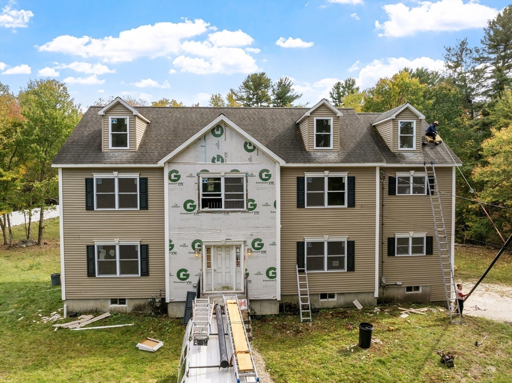 12 Patten Road Westford, MA 01886 - Photo 2 of 3 a front view of a house with a yard
