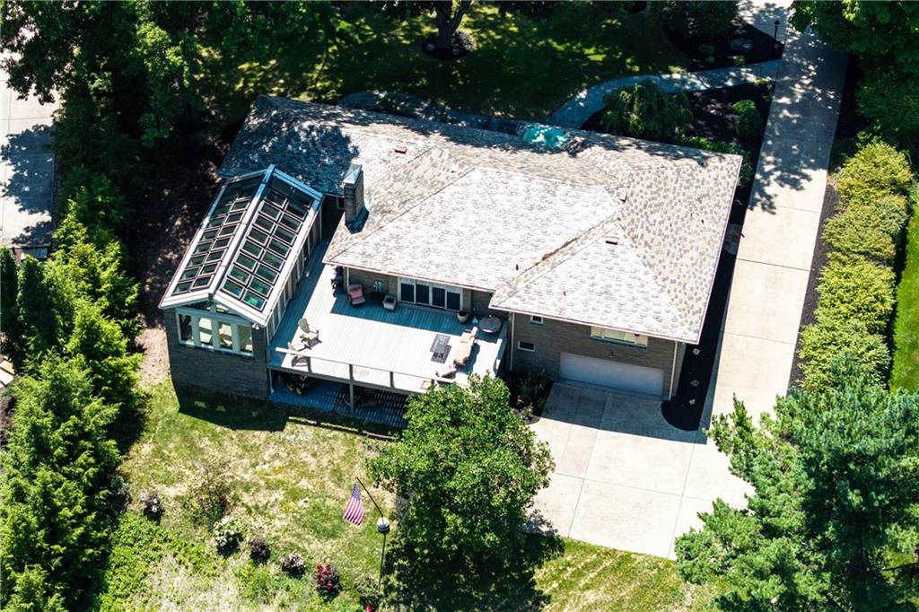 1663 Hastings Mill Road Upper St. Clair, PA 15241 - Photo 15 of 37 Aerial view of the stone ranch with solarium and indoor pool.