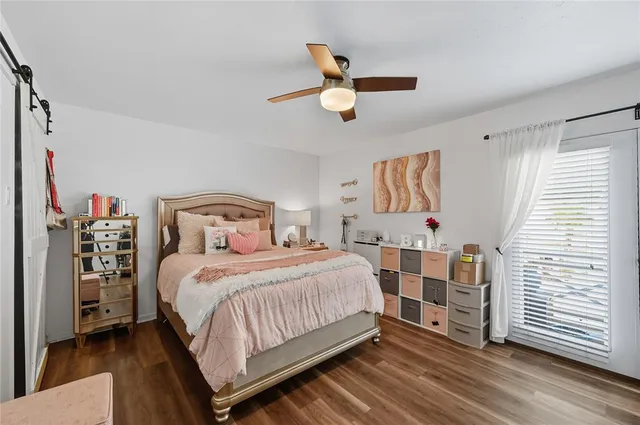 a bedroom with a bed and dresser