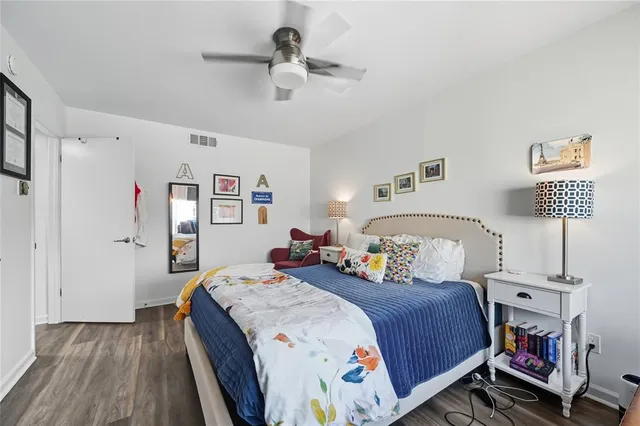 a bedroom with a bed and a table