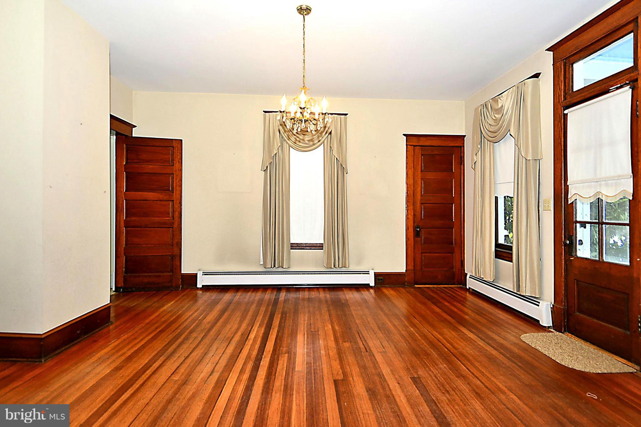 15425 Barnesville Road Boyds, MD 20841 - Photo 6 of 30 a view of a room with wooden floor and windows