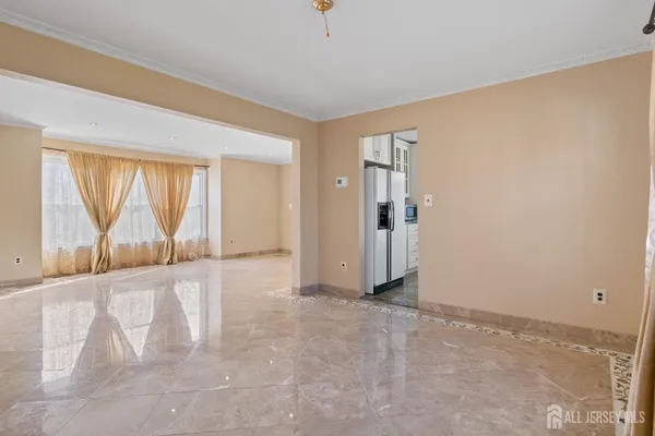 an empty room with large windows