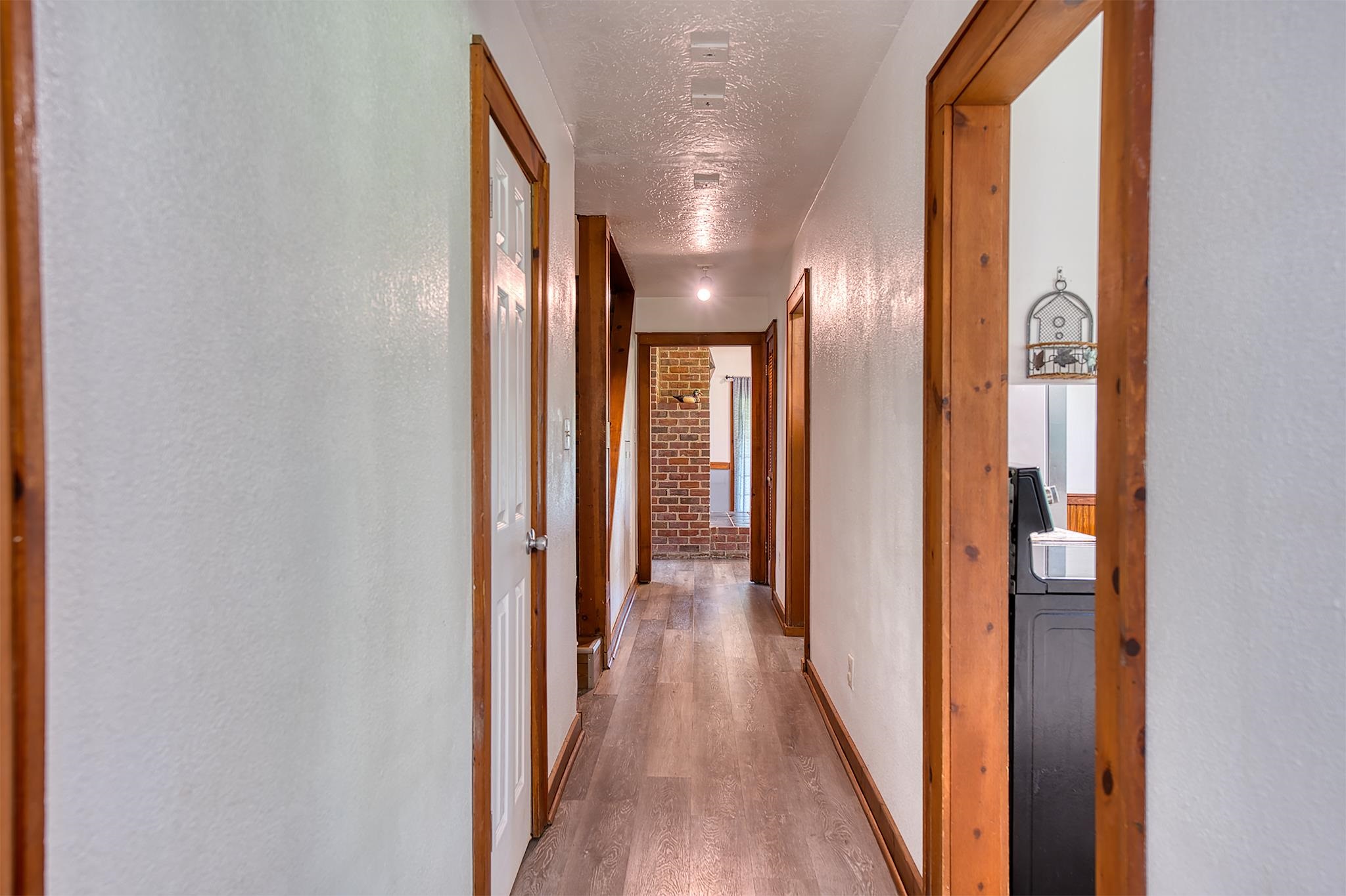 7476 Foard Road Beaumont, TX 77705 - Photo 13 of 49 a view of hallway with wooden floor