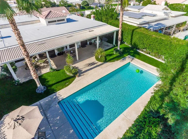 a view of a balcony with chairs
