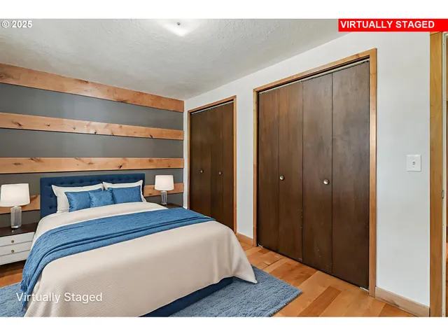 a bedroom with a large bed and a closet