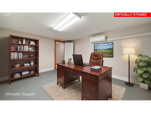 a living room with furniture and a desk