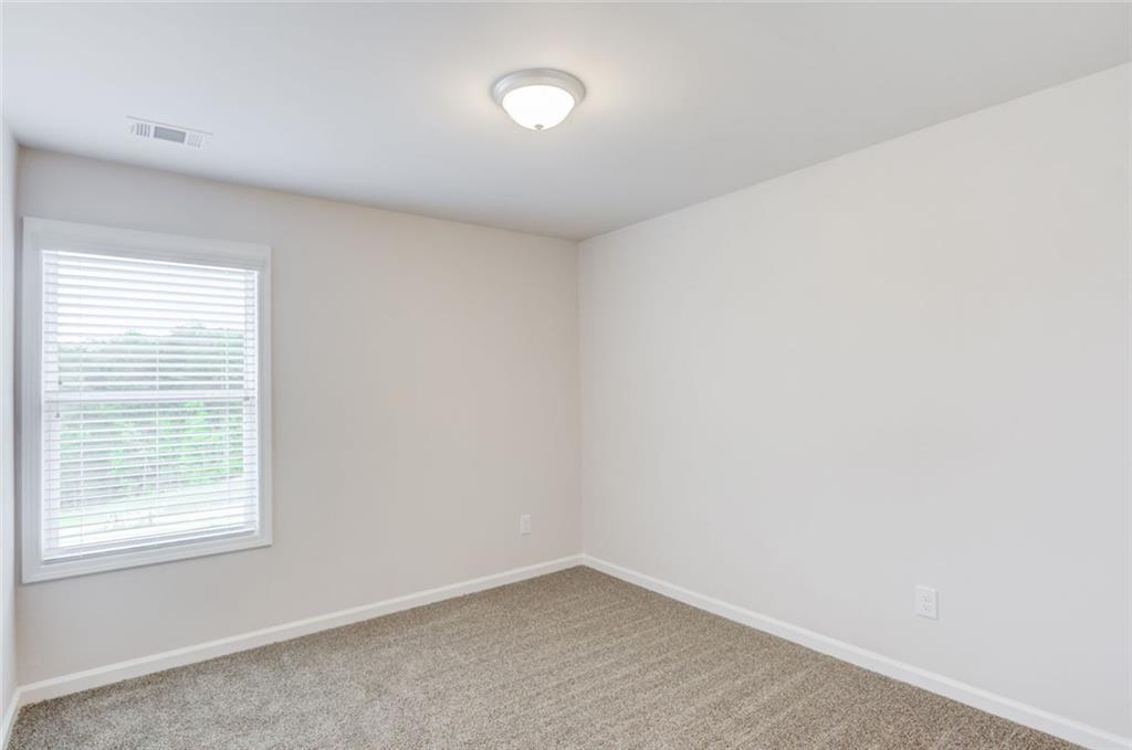 6354 Pine Ridge Point Lula, GA 30554 - Photo 24 of 33 an empty room with a window