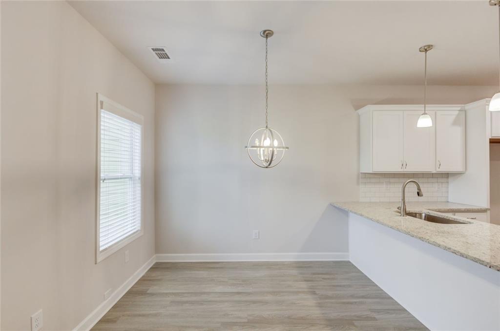 6354 Pine Ridge Point Lula, GA 30554 - Photo 10 of 33 a bathroom with a sink and a mirror