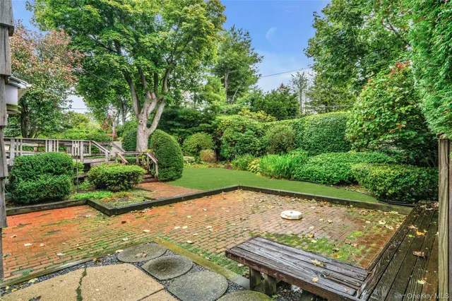 a view of a backyard with sitting area
