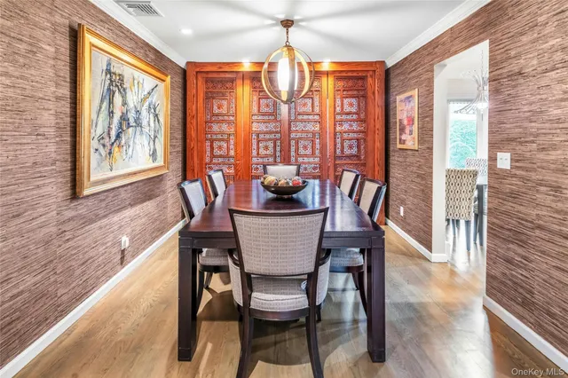 a dining room with furniture window wooden floor