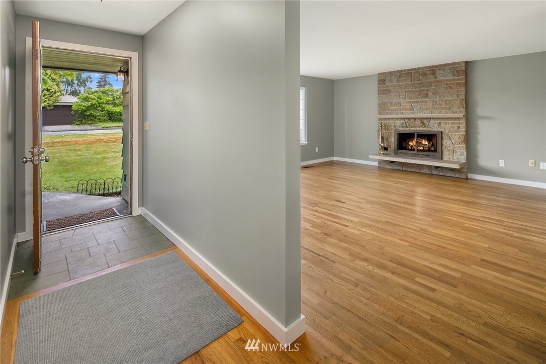 1110 Olympia Avenue Northeast Renton, WA 98056 - Photo 3 of 20 a view of livingroom with furniture and a fireplace