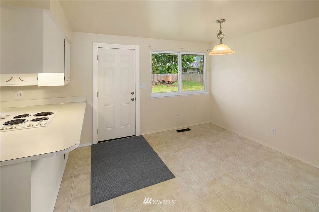1110 Olympia Avenue Northeast Renton, WA 98056 - Photo 9 of 20 a view of a kitchen with a sink dishwasher and a microwave oven