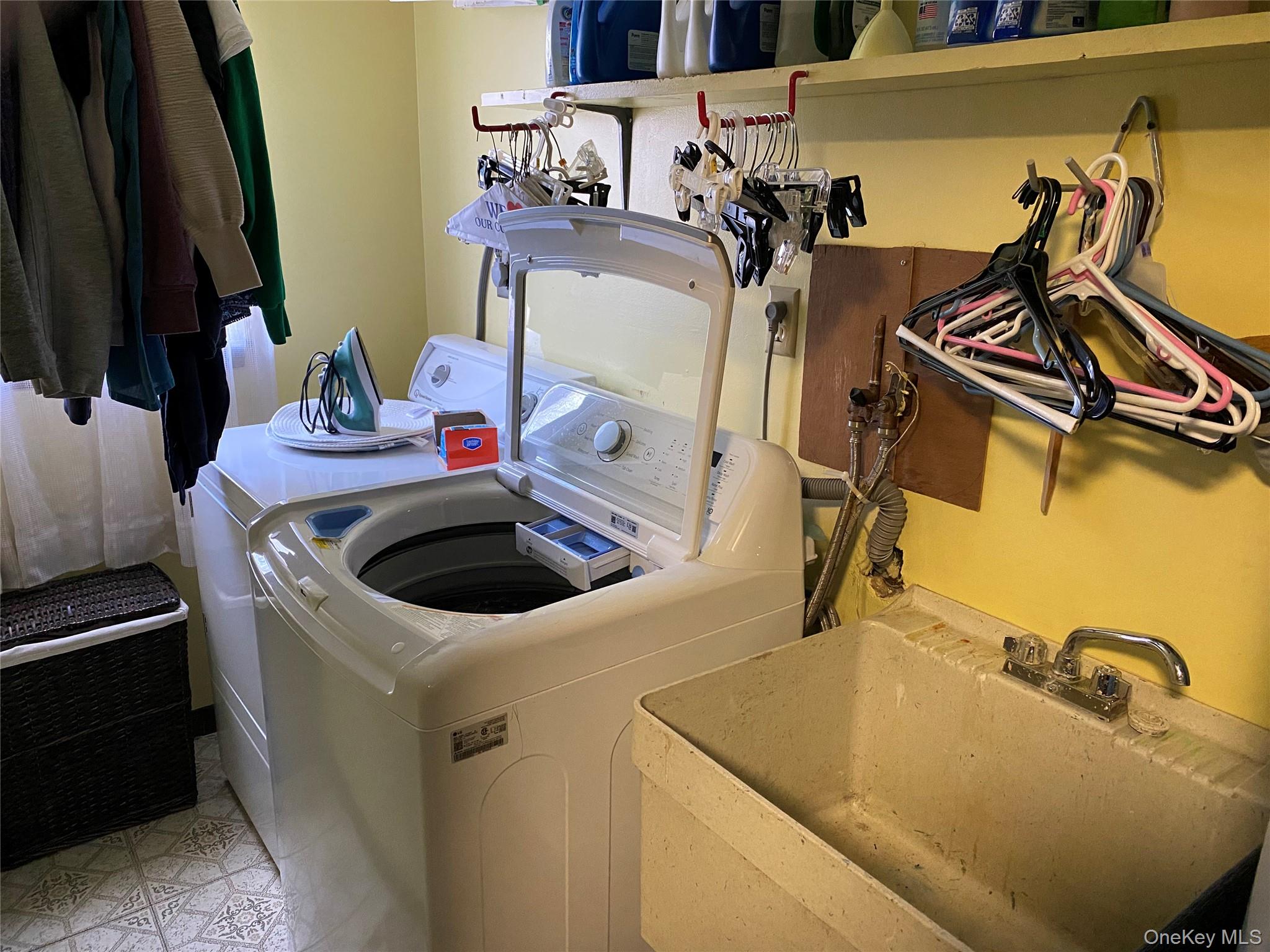 23 Colton Road Mahopac, NY 10541 - Photo 14 of 35 Laundry area with a utility sink and tiled flooring