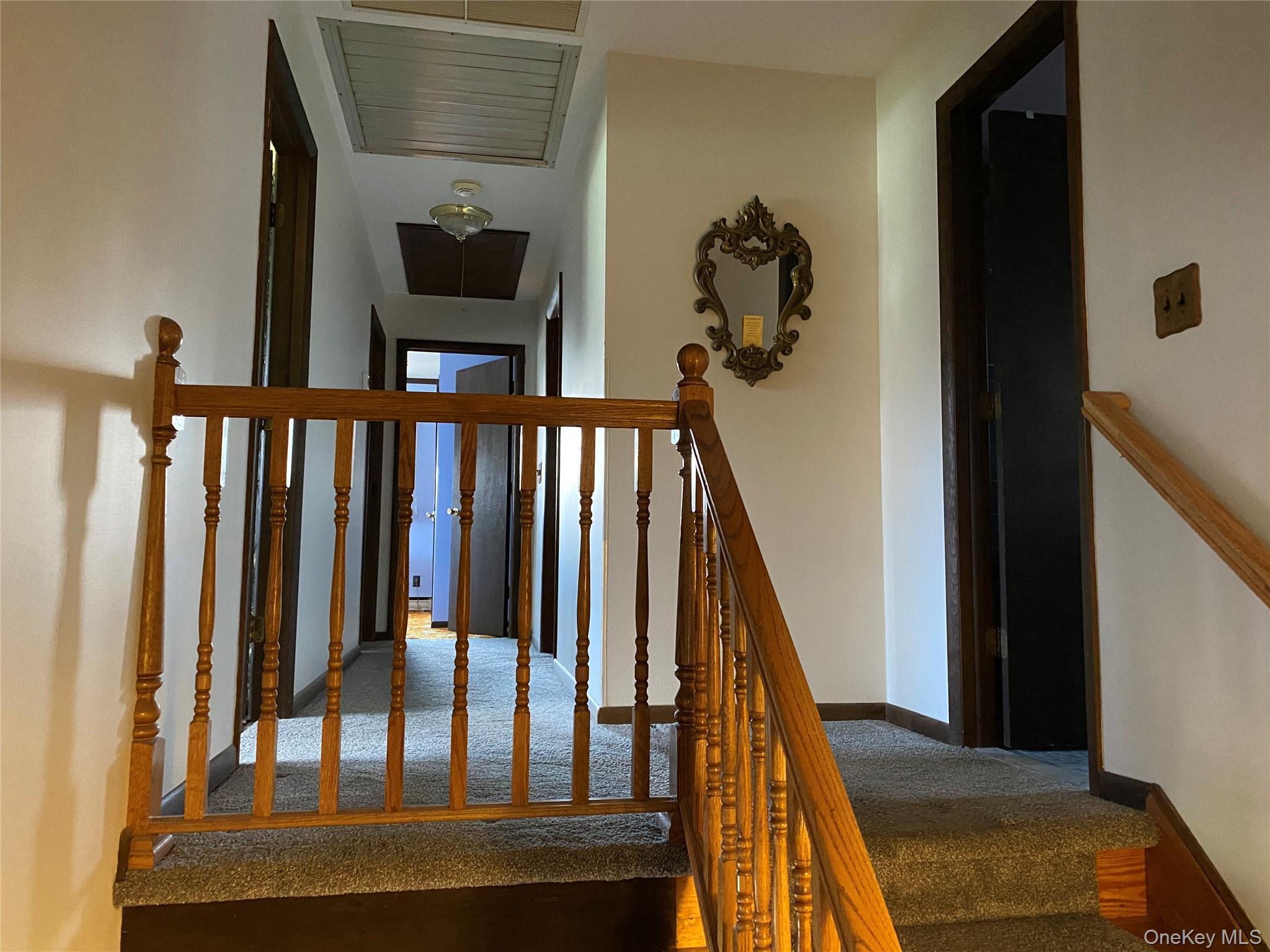 23 Colton Road Mahopac, NY 10541 - Photo 25 of 35 Staircase with wooden balusters and handrail, leading to the 4 bedrooms.