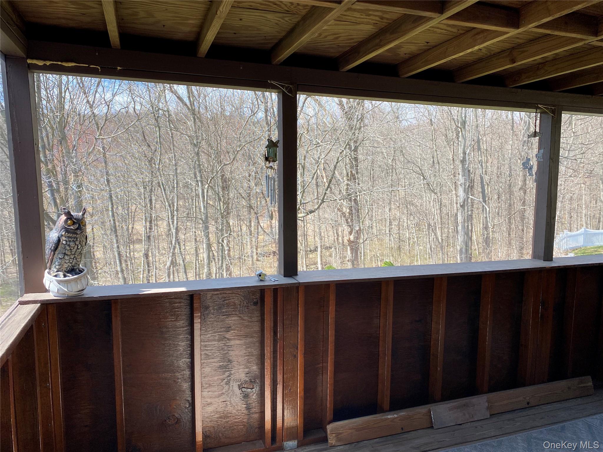 23 Colton Road Mahopac, NY 10541 - Photo 8 of 35 This property includes a screened porch with views of a natural wooded landscape