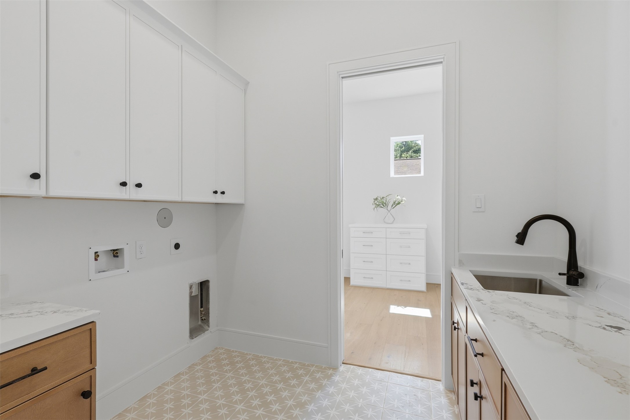 8021 Turquoise Lane Houston, TX 77055 - Photo 26 of 46 Well-appointed laundry room with sink and storage