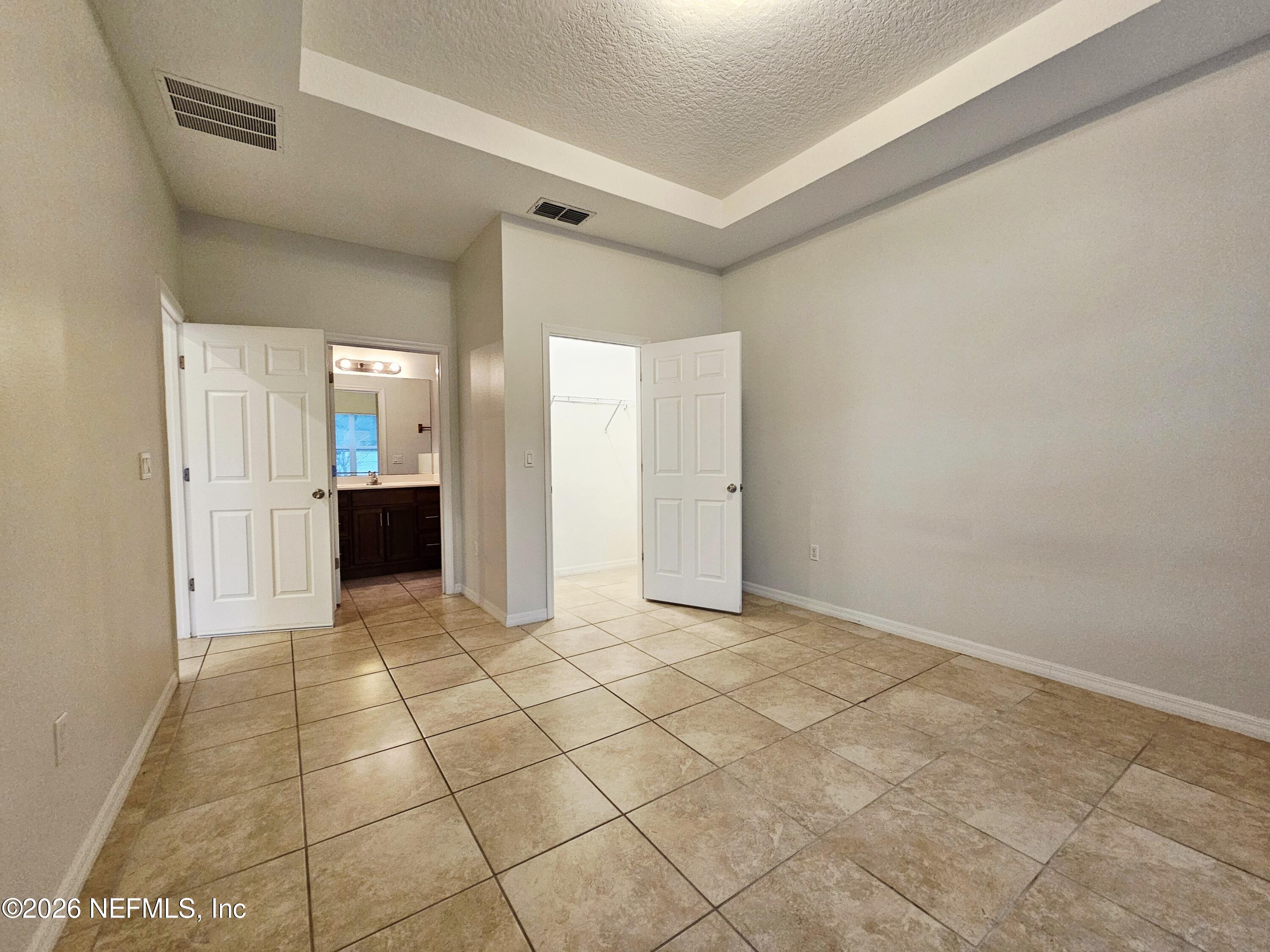 44 Prosperity Lane, Unit A Palm Coast, FL 32164 - Photo 5 of 9 a view of a sink and a refrigerator in a room
