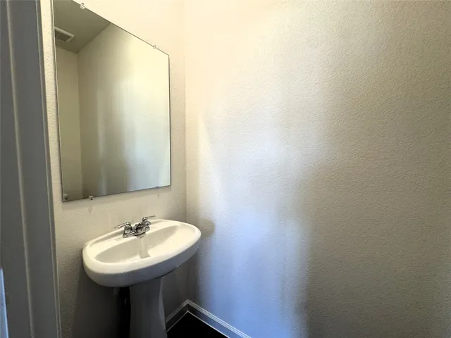 a view of a storage and utility room in a house