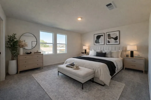 a bathroom with a granite countertop sink toilet and mirror
