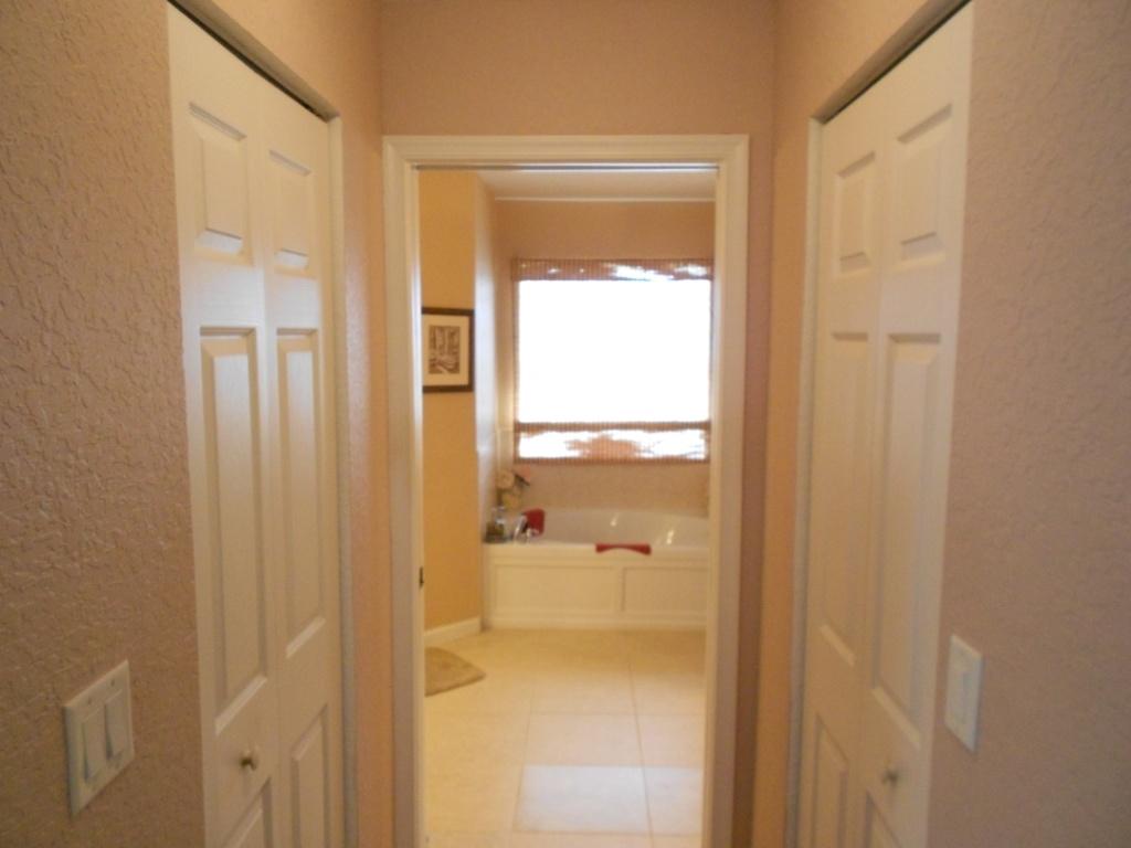 581 Southwest Halkell Avenue Port St. Lucie, FL 34953 - Photo 18 of 30 Master - His & Hers Closet