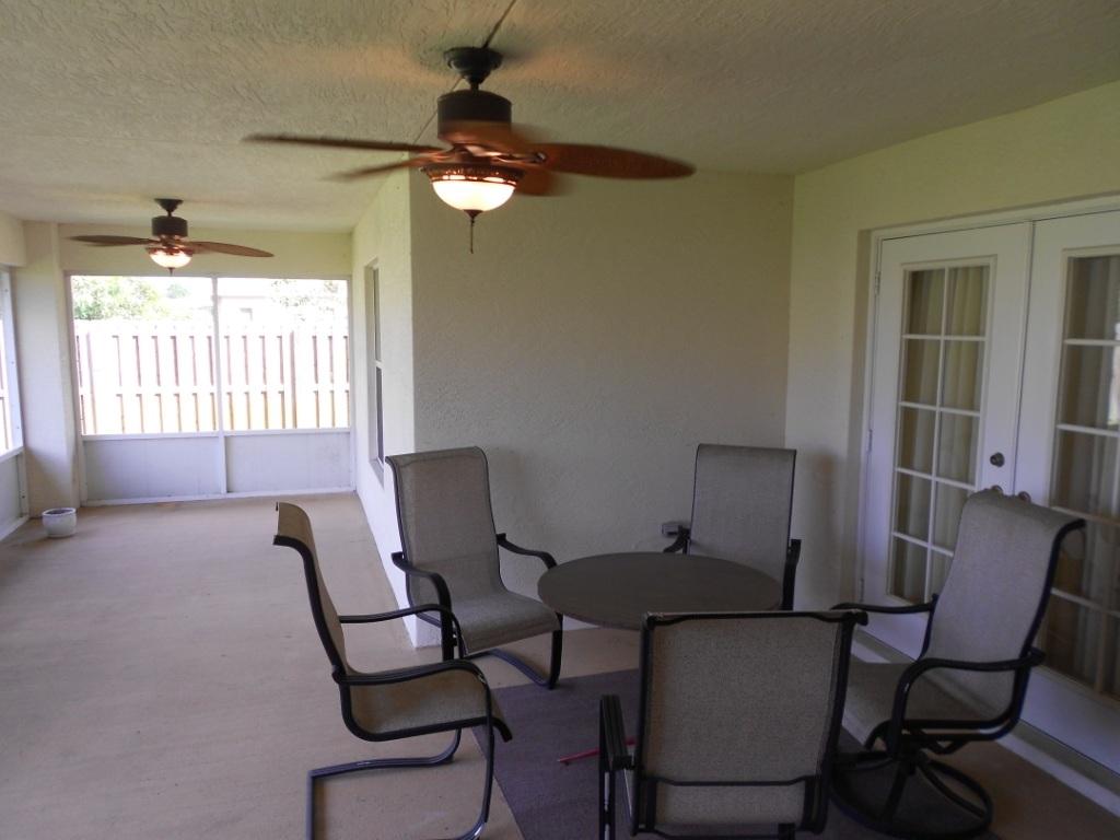 581 Southwest Halkell Avenue Port St. Lucie, FL 34953 - Photo 28 of 30 Screened Patio