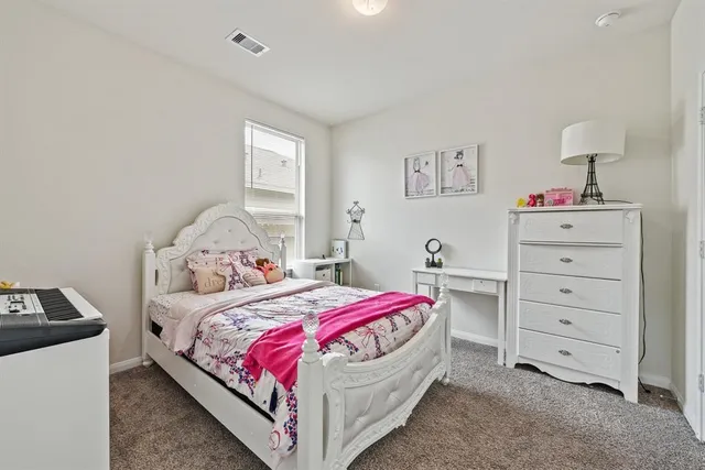 a bedroom with a bed and a closet